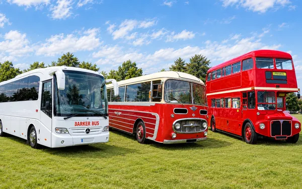 A modern Barker Bus coach, a vintage coach and a Routemaster