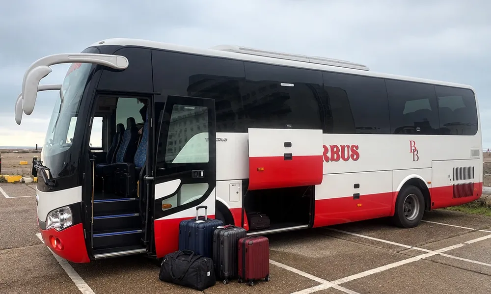 A Barker Bus coach on an airport transfer